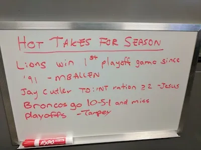 A white board of ridiculous football season hot takes from some of the members of Mildred League.